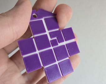 May include: A purple and white plastic tile puzzle with a grid pattern. The puzzle is made up of 16 individual squares.