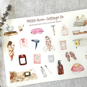 May include: A sticker sheet with watercolor illustrations of bedtime routine items. Includes a teacup, eye mask, candle, bath, and other self-care products. The text "Petite Green Cottage Co Bedtime Routine Sticker Sheet" is at the top.