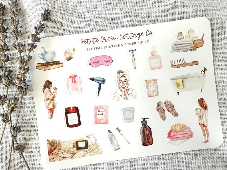 May include: A sticker sheet with watercolor illustrations of bedtime routine items. Includes a teacup, eye mask, candle, bath, and other self-care products. The text "Petite Green Cottage Co Bedtime Routine Sticker Sheet" is at the top.