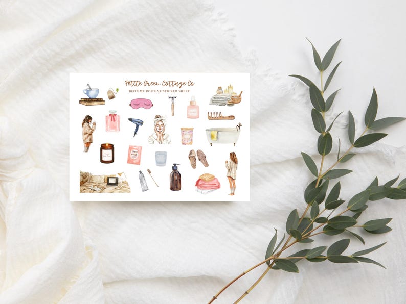 May include: A sticker sheet with watercolor illustrations of bedtime routine items. Includes a pink sleep mask, a hair dryer, a bathtub, a candle, and a woman in a robe. The text "Petite Green Cottage Co" is at the top.
