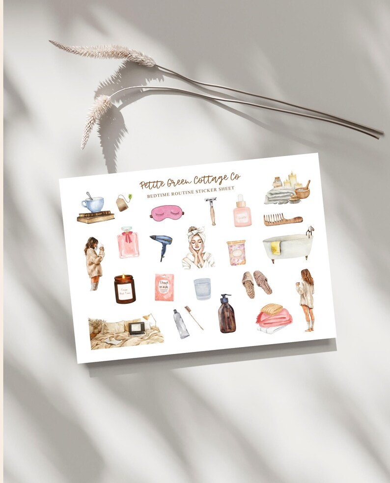 May include: A white sticker sheet with watercolor illustrations of bedtime routine items. The sheet includes images of a teacup, perfume, a hairdryer, a candle, a bath, and a person in a robe. The text "Petite Green Cottage Co" is visible.