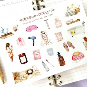 May include: A sticker sheet with watercolor illustrations of bedtime routine items. Includes a pink eye mask, a bathtub, a candle, a hair dryer, a woman in a robe, and other self-care products.