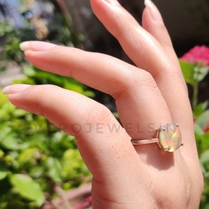 Ethiopian Opal Solitaire Ring: Sterling Silver Oval Opal (10x12 mm)