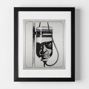 May include: Black and white framed artwork featuring a medical IV bag with a face drawn on it. The artwork is a pen and ink illustration with a surreal, slightly unsettling theme. The IV bag is suspended from a metal stand.