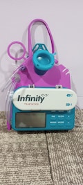 Tubie hang™ g-tube feeding pump hanger works with enfit™ caps
