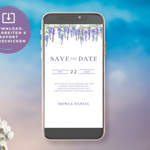 May include: A purple and white floral save the date card on a smartphone screen. The text reads "Save the Date" with the date "May 22, 2023". The text below reads "Bitte haltet euch diesen Tag fur unsere freie Trauung mit anschliessender Feier frei. Details folgen in der Einladung." and "MONI & DANIEL".