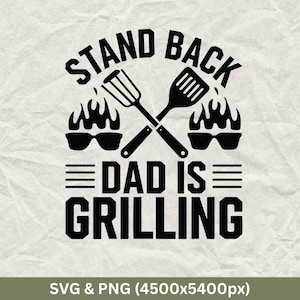 May include: Black and white graphic design with the text "Stand Back Dad Is Grilling". The design features two crossed grilling tools, flames, and sunglasses.