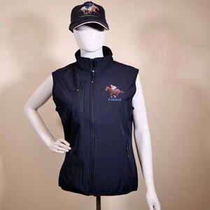 May include: A navy blue softshell vest with a zip closure and two zipped pockets. The vest features a horse racing themed embroidered logo with the text "Frankel".