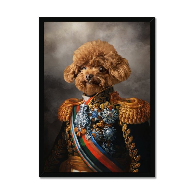 May include: A framed portrait featuring a brown poodle depicted in a military uniform. The image highlights the dog's head and the ornate details of the uniform, including gold epaulettes, medals, and a colourful sash. The background is a soft grey.
