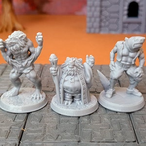 May include: Three gray painted miniature figurines on round bases. The figurine on the left is a werewolf, the middle figurine is a stout wizard, and the figurine on the right is a humanoid with a shark head.
