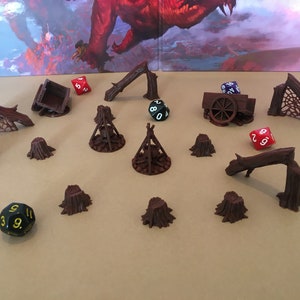 May include: A set of 3D printed miniature dungeon scenery pieces, including a broken wagon, tree stumps, and fallen logs. The pieces are painted in a brown color and are perfect for tabletop role-playing games.
