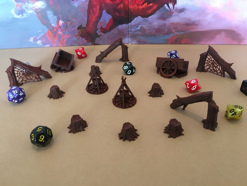 May include: A set of 3D printed miniature dungeon scenery pieces, including a broken wagon, tree stumps, and fallen logs. The pieces are painted in a brown color and are perfect for tabletop role-playing games.