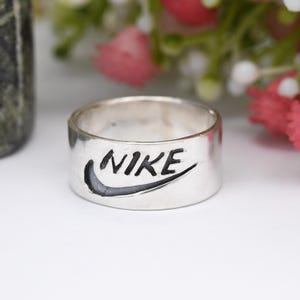 Silver nike ring Etsy Mexico