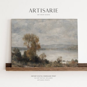 May include: A digital download print of a painting depicting a lake scene with trees and a cloudy sky. The painting is in a muted color palette of blues, grays, and browns. The print is available in six different aspect ratios.