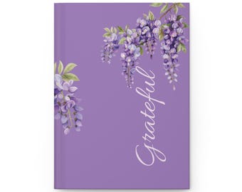 Cuaderno con diseño floral de glicinias lilas y hojas rayadas