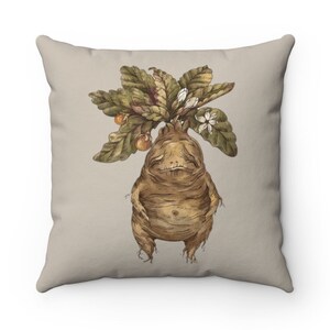 May include: A decorative throw pillow with a beige background featuring a whimsical illustration of a brown, humanoid plant with green leaves and white flowers.