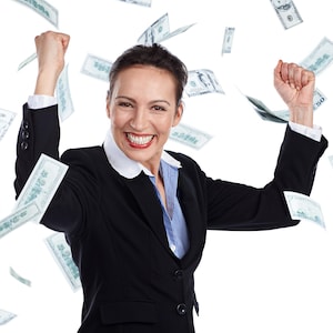 May include: A woman in a black blazer and a blue striped shirt smiles with arms raised as US dollar bills float around her. The woman has short dark hair and a white collar. The background is white.