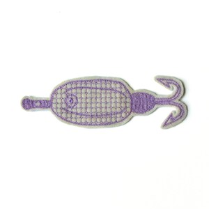 May include: Purple embroidered patch of a seahorse with a textured body and a curled tail.