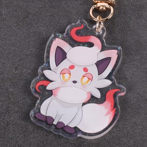 Hisuian Zorua - Colores brillantes y reverso holográfico - Amuleto Pokémon