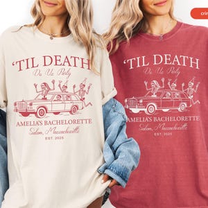 Two women wearing t-shirts with the same design, featuring a car with skeleton figures and text related to a bachelorette party.
