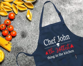 Personalized The Hottest Thing In The Kitchen Apron, Adjustable Neck, Funny Apron, Custom Name Cooking Apron with Pockets, BBQ Cooking Apron