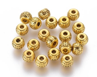 20 perles rondelles intercalaires 7x3,2mm trou 4,4mm métal couleur BRONZE MB51 20 perles rondelles intercalaires 7x3,2mm trou 4,4mm métal couleur BRONZE MB51