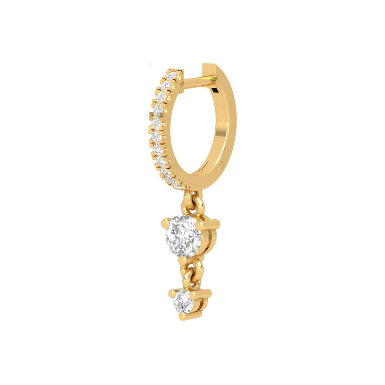 May include: Gold hoop earring with a dangling chain and two small round diamonds.