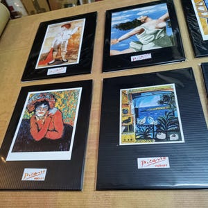 Picasso postcards on a rigid envelope and bag