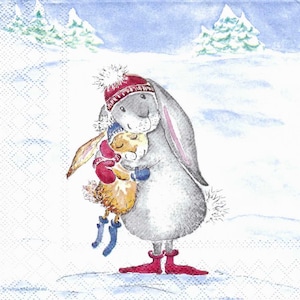 May include: A gray bunny wearing a red hat with a white pom-pom hugs a smaller brown bunny wearing a blue hat and red mittens. Both bunnies are standing in a snowy landscape with two green trees in the background.