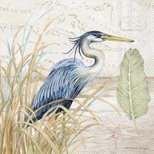 May include: Watercolor painting of a blue heron standing in tall grass, with a map of the Caribbean Sea in the background. A large green leaf and a starfish are also visible. The artwork is signed by Susan Winget.