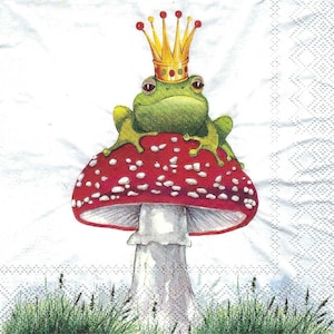 May include: A green frog wearing a gold crown sits on top of a red and white mushroom with white spots. The mushroom has a white stem.