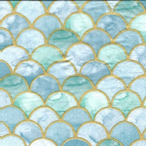 May include: A blue and green patterned paper with a gold scale design. The paper has a textured surface.
