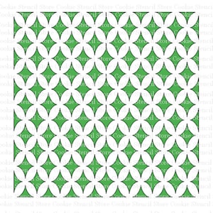 May include: A cookie stencil with a repeating pattern of overlapping circles and diamonds. The stencil is made of white plastic and has a green background.