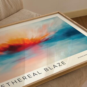 Fiery red and orange sunrise painting with calming blue shades.
