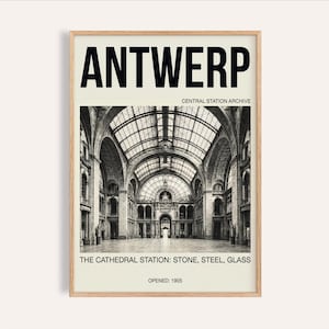 May include: A framed print showing a monochrome photograph of Antwerp Central Station's interior. The word "ANTWERP" is printed in bold above the image, with "CENTRAL STATION ARCHIVE" below. The text "THE CATHEDRAL STATION: STONE, STEEL, GLASS" and "OPENED: 1905" are also included.