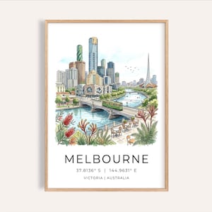 May include: A framed watercolour print of Melbourne, Australia, depicting a cityscape with skyscrapers, a river, and a green tram. The print includes the city's name, coordinates, and state. The frame is light brown wood.