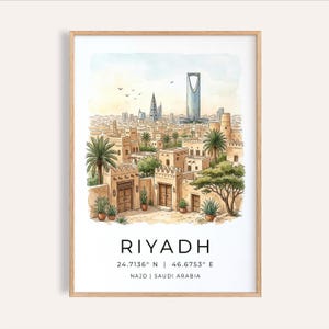 May include: Watercolor print of Riyadh, Saudi Arabia, in a wooden frame. The artwork depicts a cityscape with traditional buildings, palm trees, and a modern skyscraper. The city's name and coordinates are printed at the bottom.