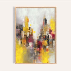 Puede incluir: Lámina de arte abstracto de paisaje urbano enmarcada en madera. La obra presenta una vibrante paleta de tonos amarillos, rojos y grises, que representa una escena urbana estilizada. Las pinceladas crean un efecto texturizado, con los edificios y el cielo mezclándose.