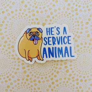 May include: A sticker featuring a cartoon pug with its tongue sticking out. The text "He's a service animal" is written in blue letters.