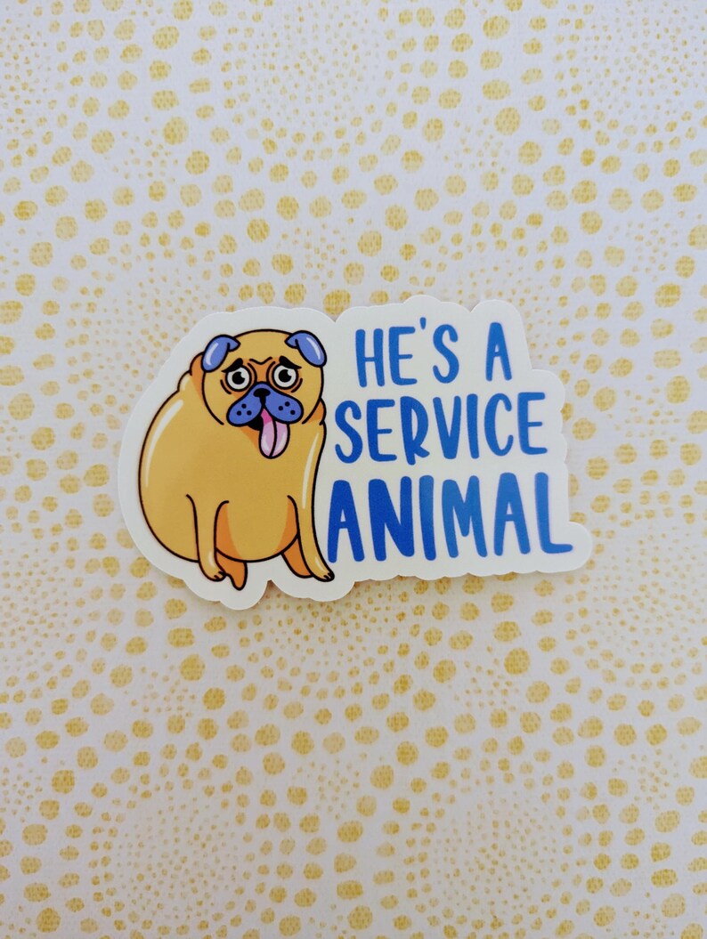 May include: A sticker featuring a cartoon pug with its tongue sticking out. The text "He's a service animal" is written in blue letters.