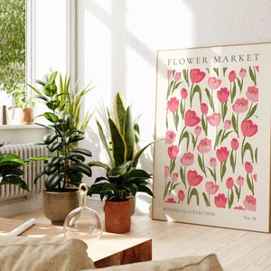 May include: A framed print featuring a floral pattern of pink tulips on a white background. The print is titled "FLOWER MARKET" and has the text "BOTANICAL COLLECTION No. 14" at the bottom.
