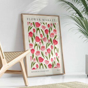 May include: A framed print featuring a floral design with pink and green tulips. The print is titled "Flower Market" and is part of a "Botanical Collection".