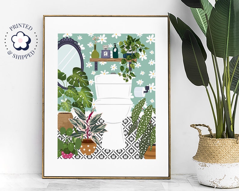 May include: A white toilet with a green and white floral wallpaper background. The toilet is surrounded by potted plants, including a monstera plant, a snake plant, and a calathea plant. The floor is tiled with a black and white geometric pattern.