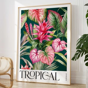 May include: A framed print with a tropical theme featuring pink and green foliage, flowers, and the word "TROPICAL" in white text. The background is a dark teal green.