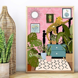 May include: A pink and green illustrated print featuring a leopard climbing a staircase with plants and a dresser. The print has a pink background with a white and black geometric pattern at the bottom.