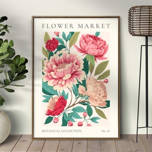 Pu&ograve; includere: Una stampa botanica incorniciata con un arrangiamento di fiori rosa e bianchi con foglie verdi. La stampa ha il testo "FLOWER MARKET" in alto e "BOTANICAL COLLECTION No. 26" in basso.
