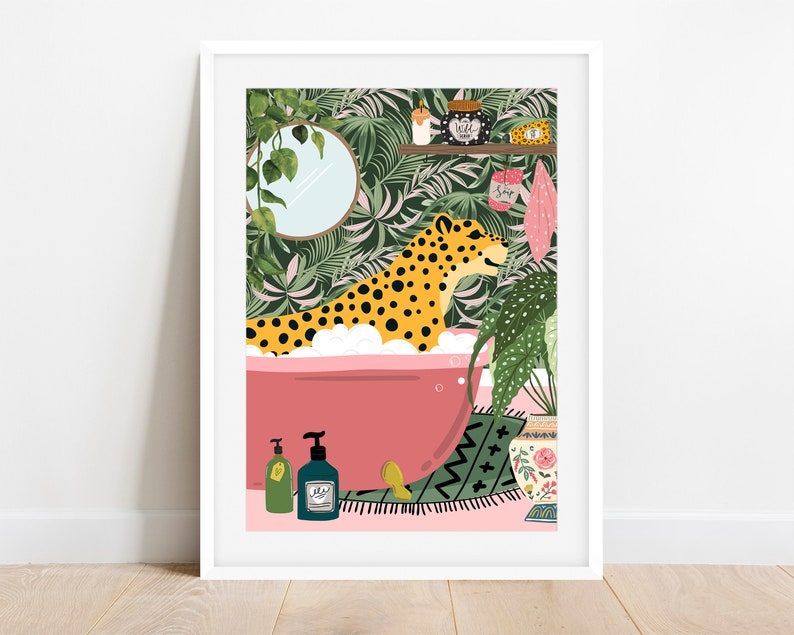 May include: A leopard print animal is taking a bath in a pink bathtub with white bubbles. The bathtub is on a pink floor with a green and black rug. There are green plants and a mirror in the background.