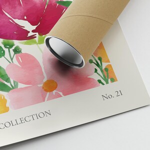May include: A watercolor print featuring pink, yellow, and green flowers. The print has the text "Botanical Collection" and "No. 21" printed on it.