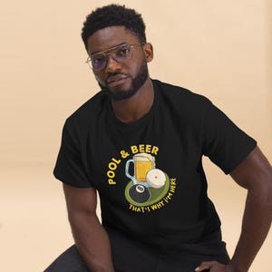 May include: Black t-shirt with a yellow graphic of a beer mug, pool balls, and the text "POOL & BEER THAT'S WHY I'M HERE".