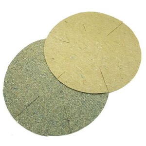 May include: Two round, flat, brown and green plant discs. The discs are made of a woven material and have a slightly textured surface.